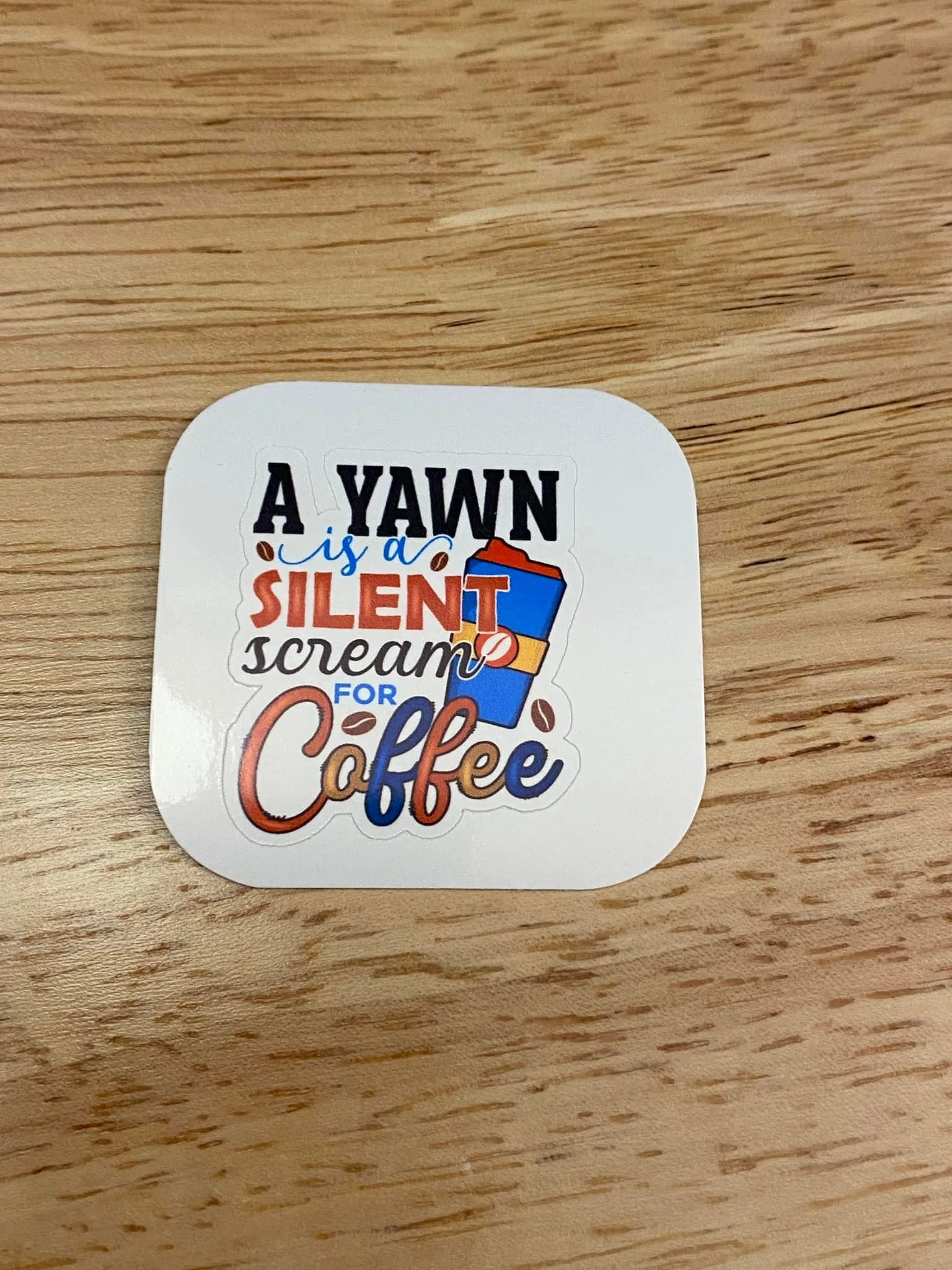 A Yawn is a Silent Scream for Coffee Sticker