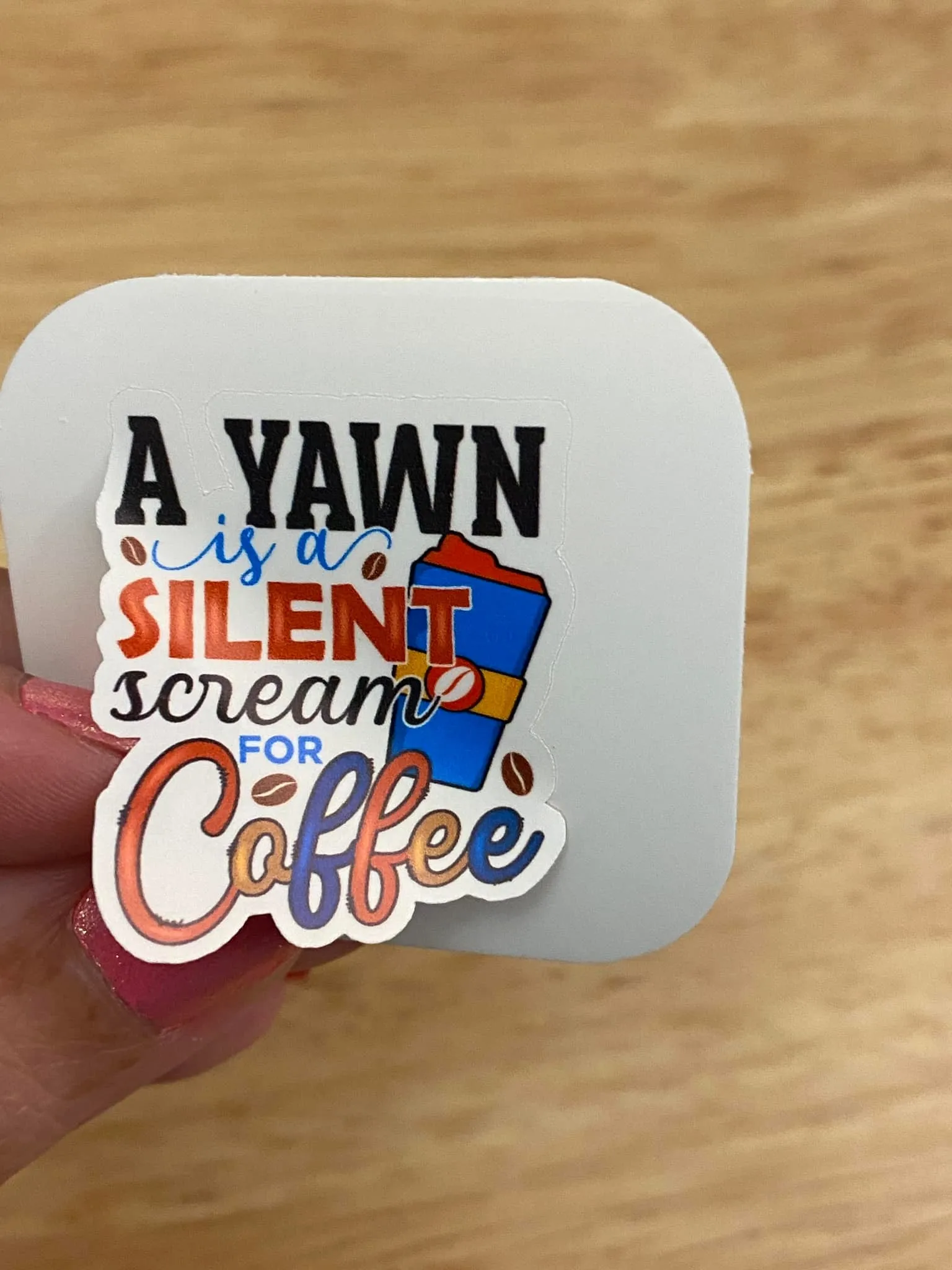 A Yawn is a Silent Scream for Coffee Sticker